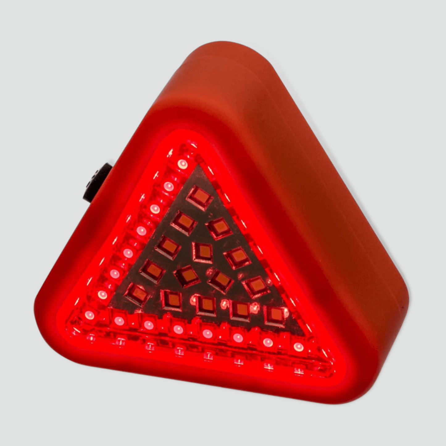 Orange safety triangle light with red light on